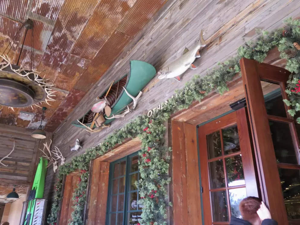 Canoe and fish above the entry door.