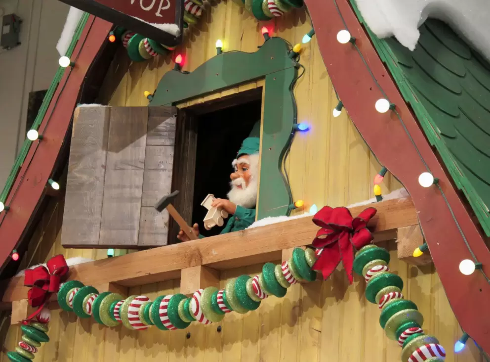 An elf pops out a window.