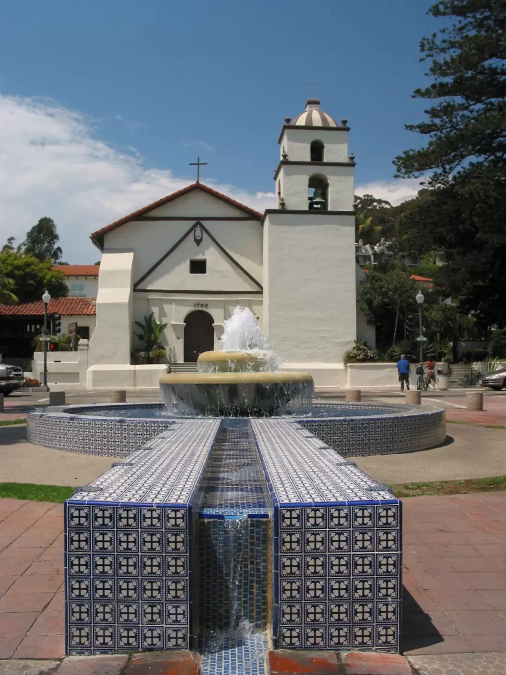 A tiled stream of water leads down far to another fountain...