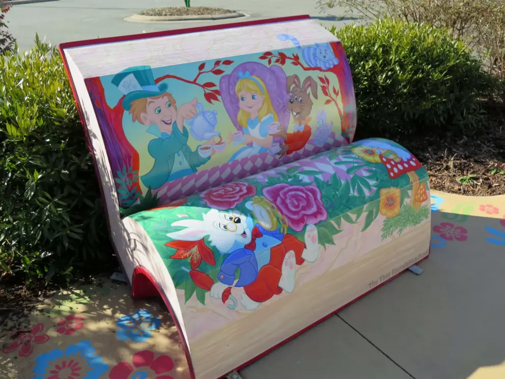Alice in Wonderland bench in the front garden.