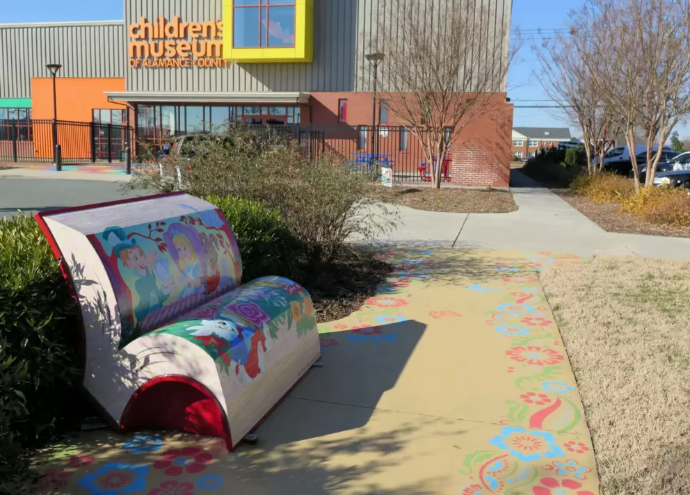 Bench and painted sidewalk.