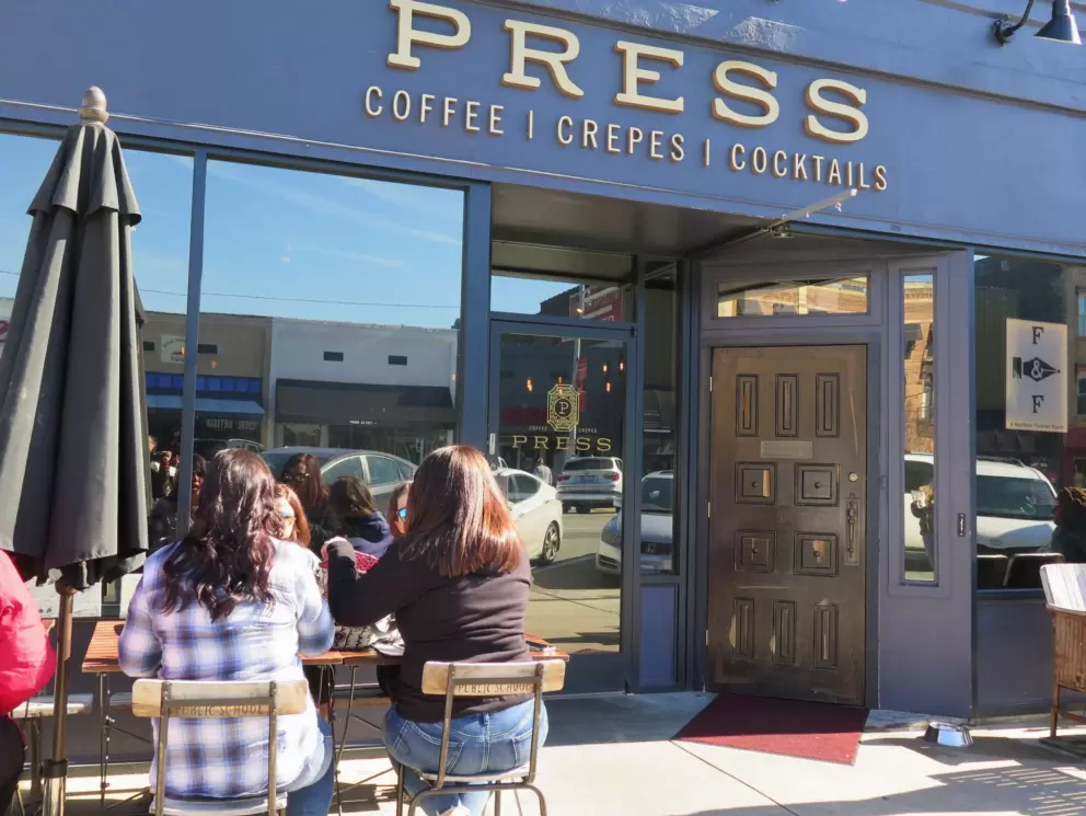 Sunny seating outside Press Coffee and Crepes, nearby in Graham.