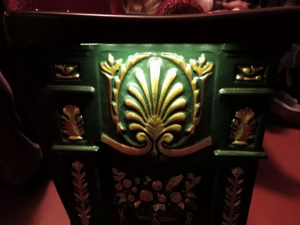 Decorations on the end of the seating rows, at Carolina Theater.