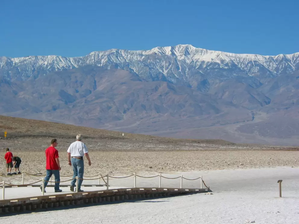 Badwater, with distant snowy Sierra Nevada mountains behind. 