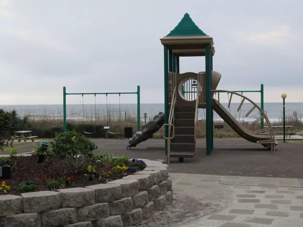 Flower beds and playground.
