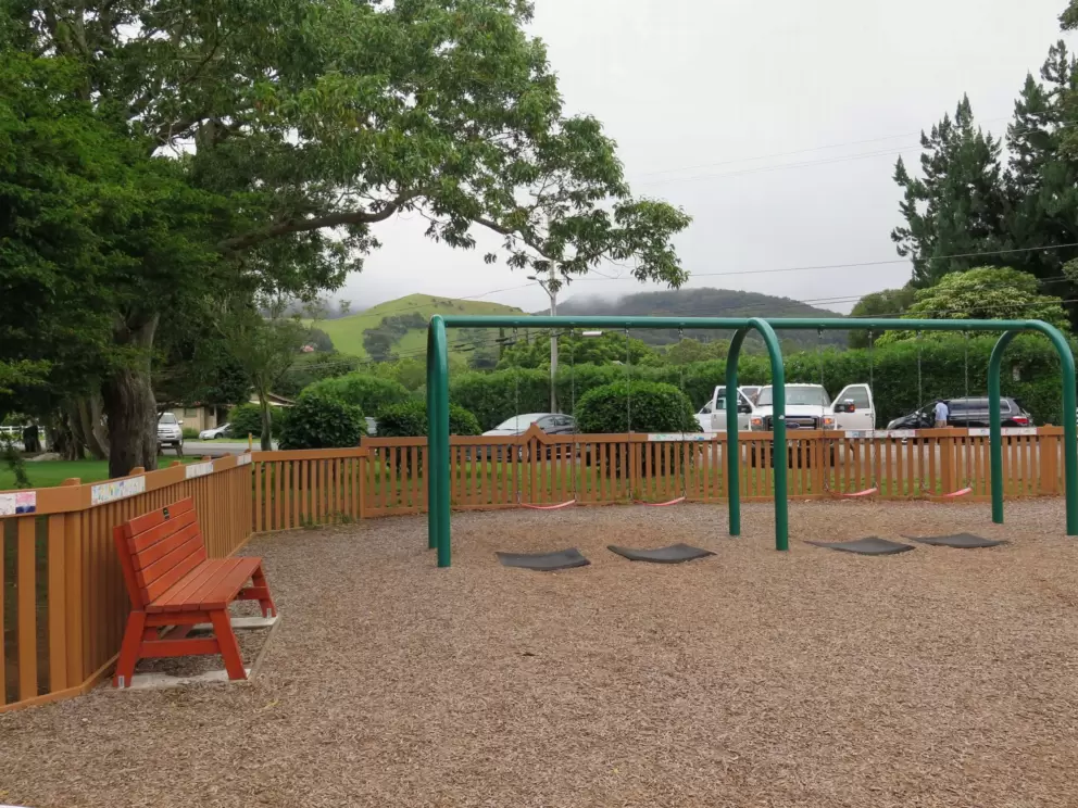 Bench for parents, and swings.