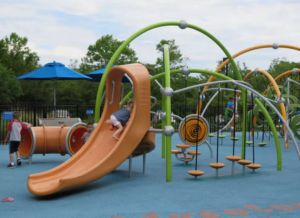 Space age playground with slides, tunnels, step stools...