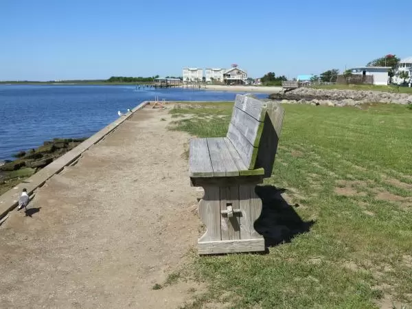 Bench by the water along West Bay Street.