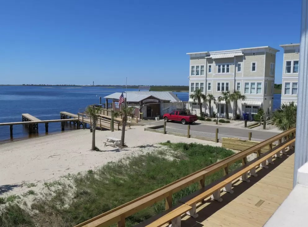 Apartment buildings and Old American Fish Company bar, seen from Frying Pan.