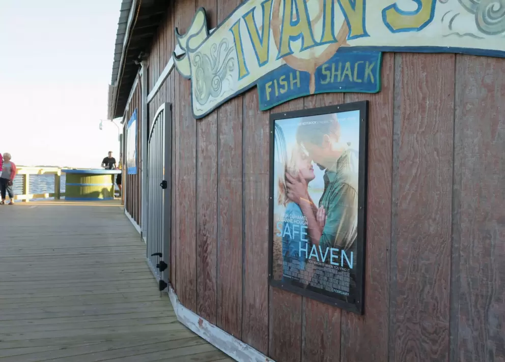 Safe Haven poster at Old American Fish Company bar.