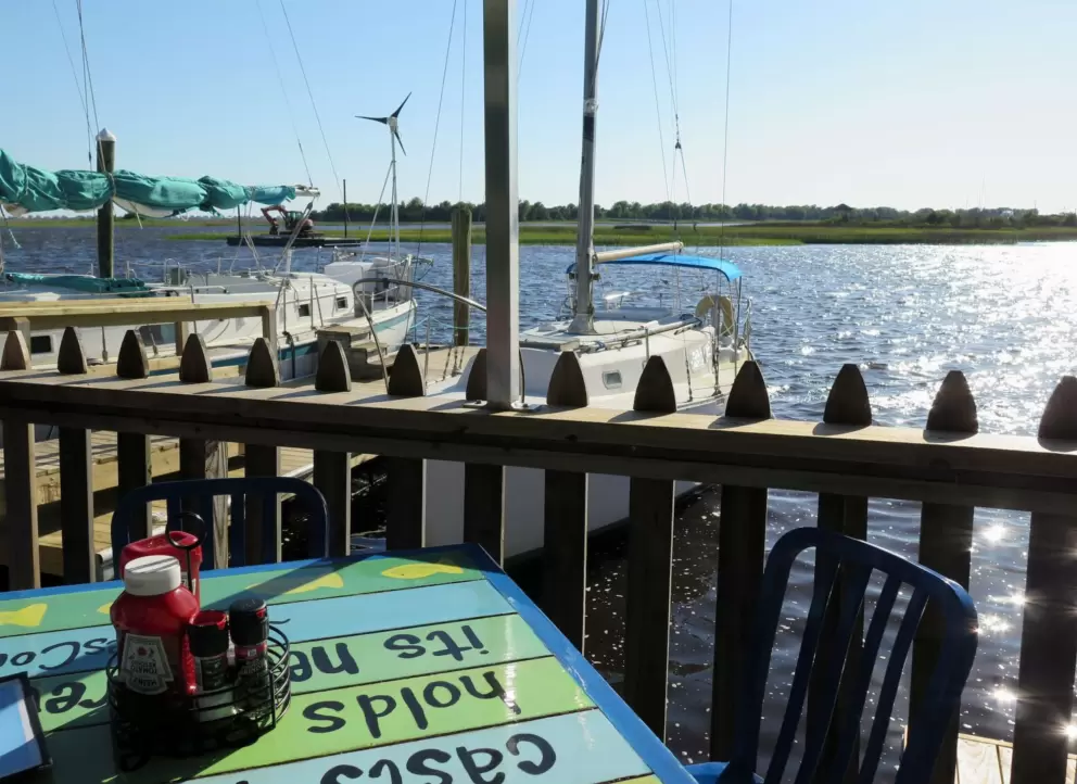 Table overlooking the yacht basin, at Fishy Fishy Cafe.