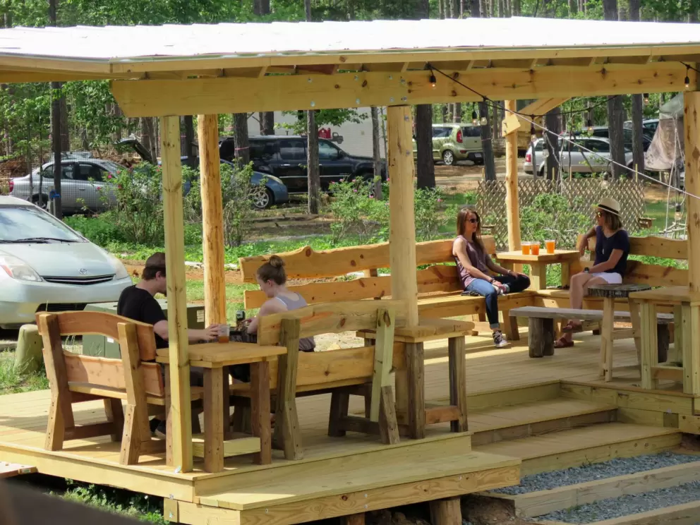 Friends chatting in the separate shaded seating.
