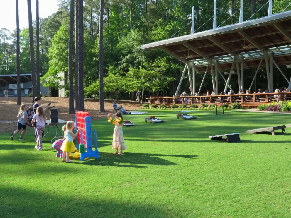 Kids gather around the giant Connect Four.