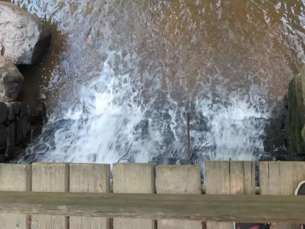 It's fun to watch the water from the bridge by the mill.