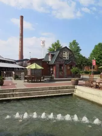 Bubbling fountain and Lucky Strike smokestack in the distance.