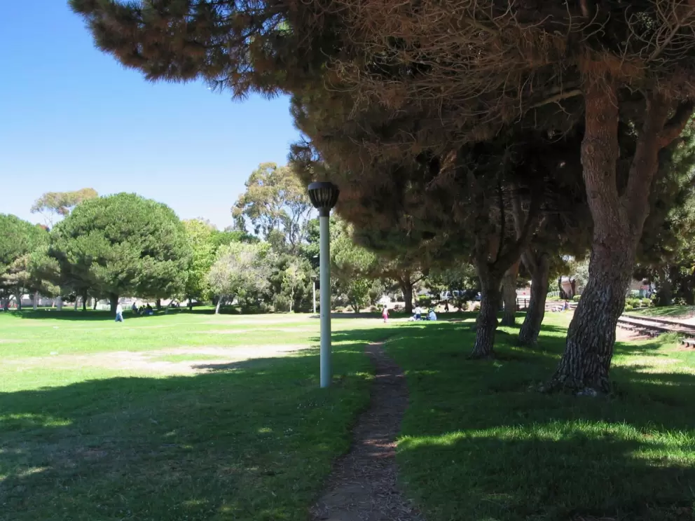Thick shade and lush grass- the little path to Moranda Park. 