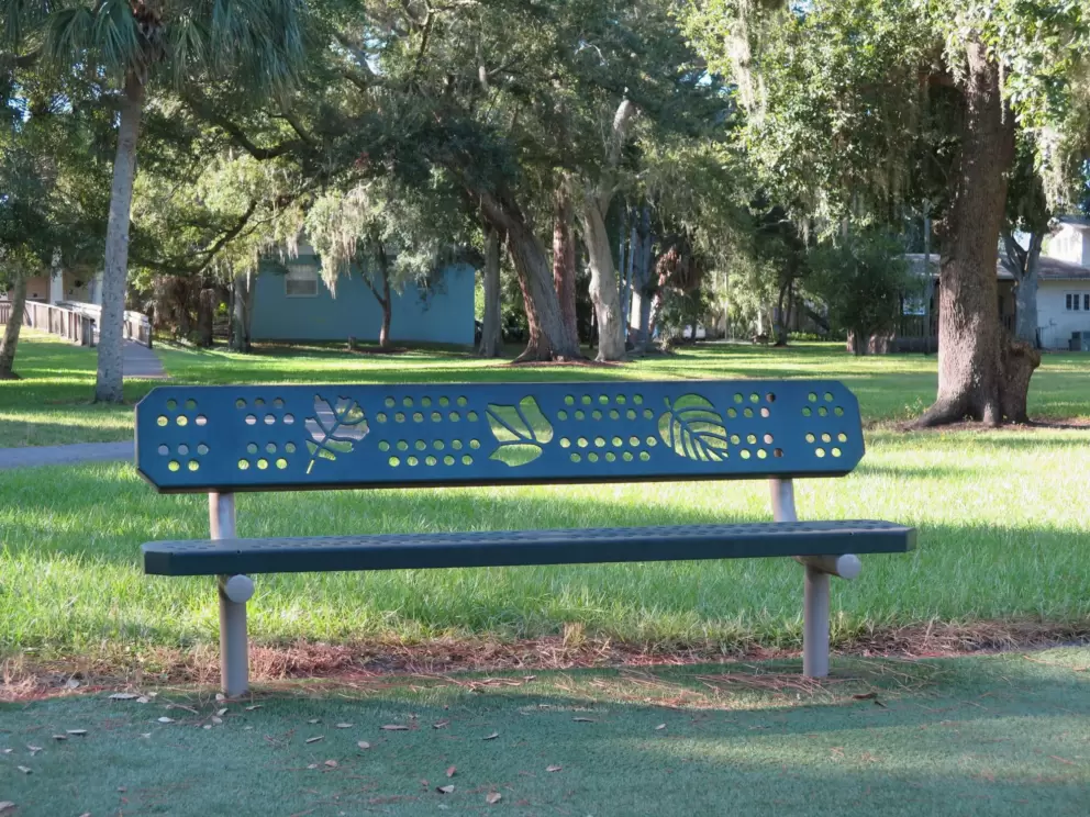Cute park bench with leaf cutouts.