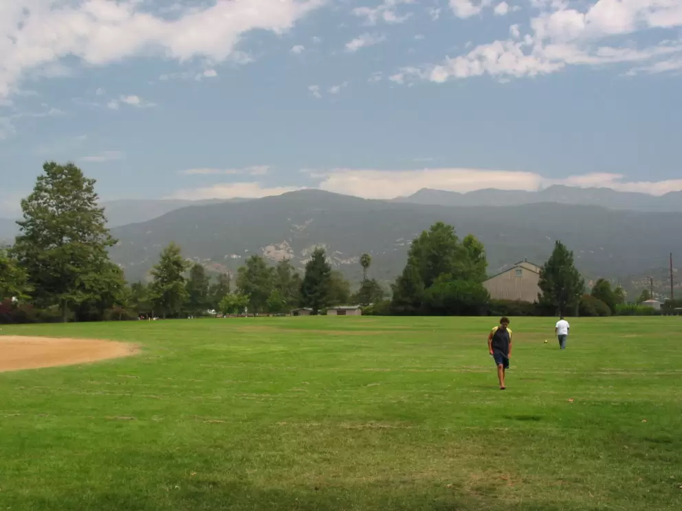 Mountain panorama and a sports field to play ball on. 