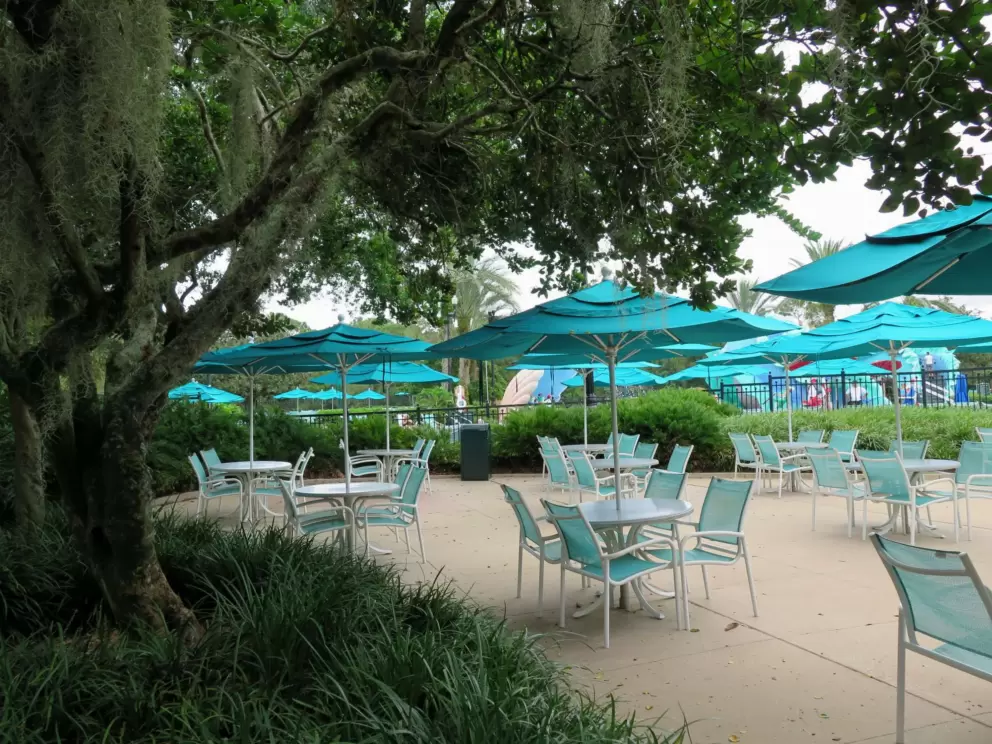 Blue-green umbrellas near the pool.