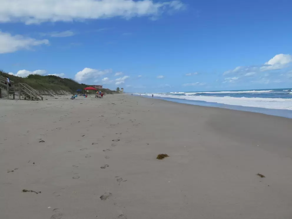 The wide expanse of beach.