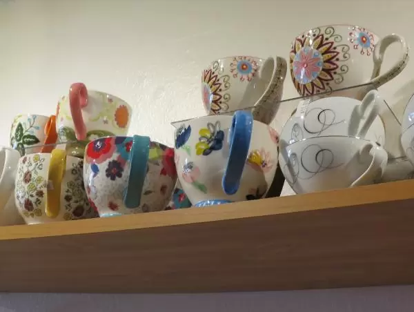 Tea cups on display at Around the World Cafe.