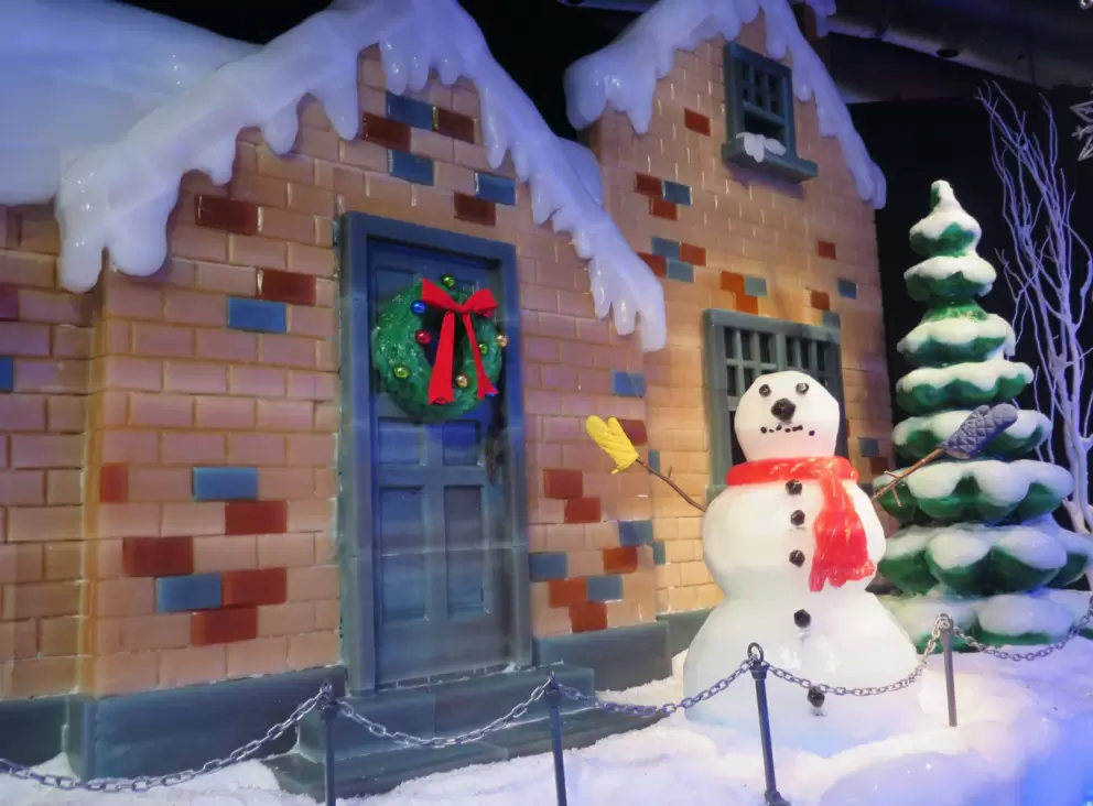 Snowman and gingerbread house made of ice.