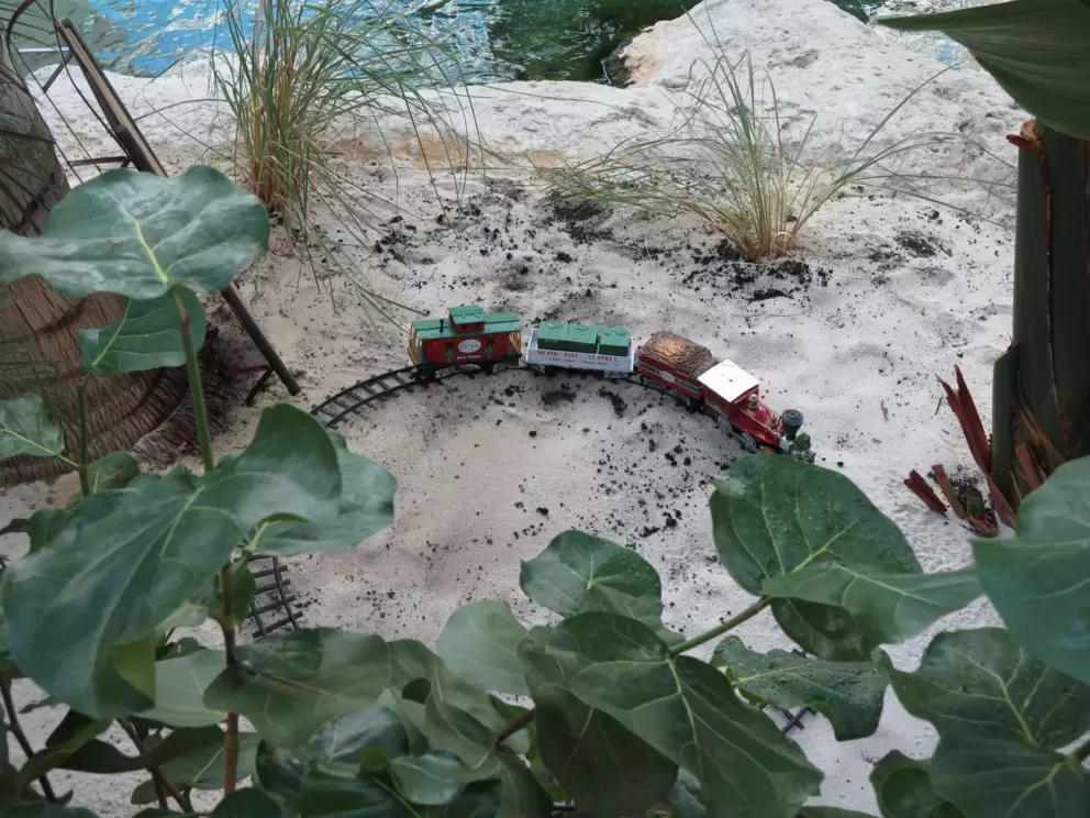 Christmas train set in the sand.