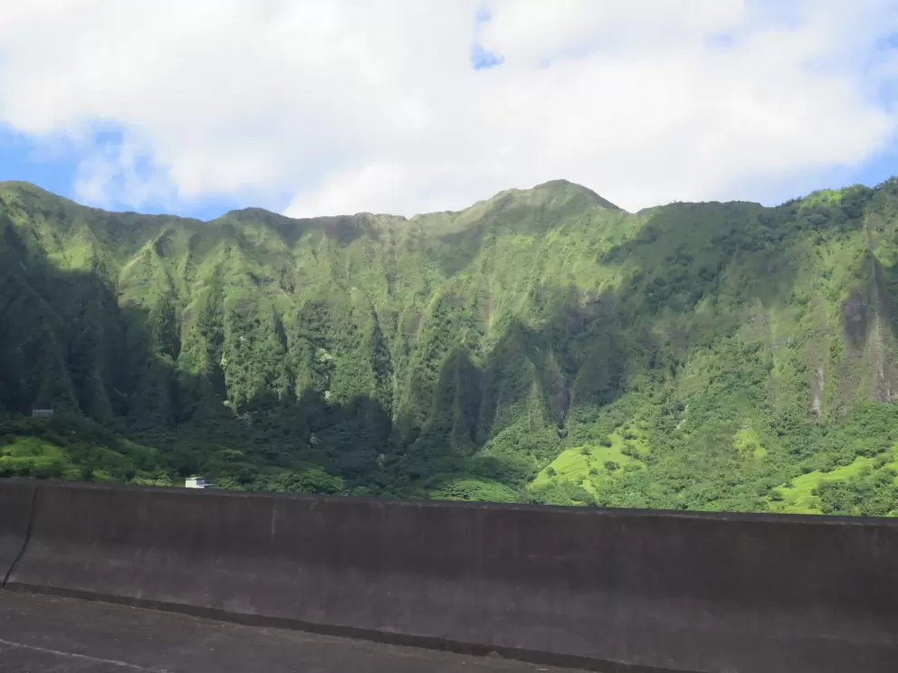 Clouds casting shadows on the mountains.