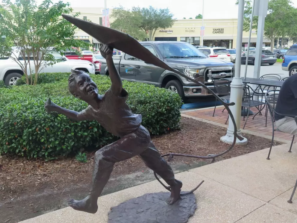 Kite flyer statue.