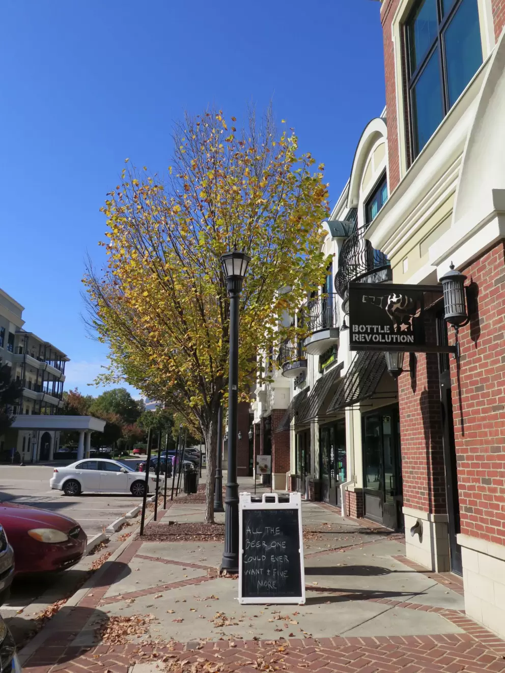 Outside Guasaca Arepas, nearby, with fall tree.