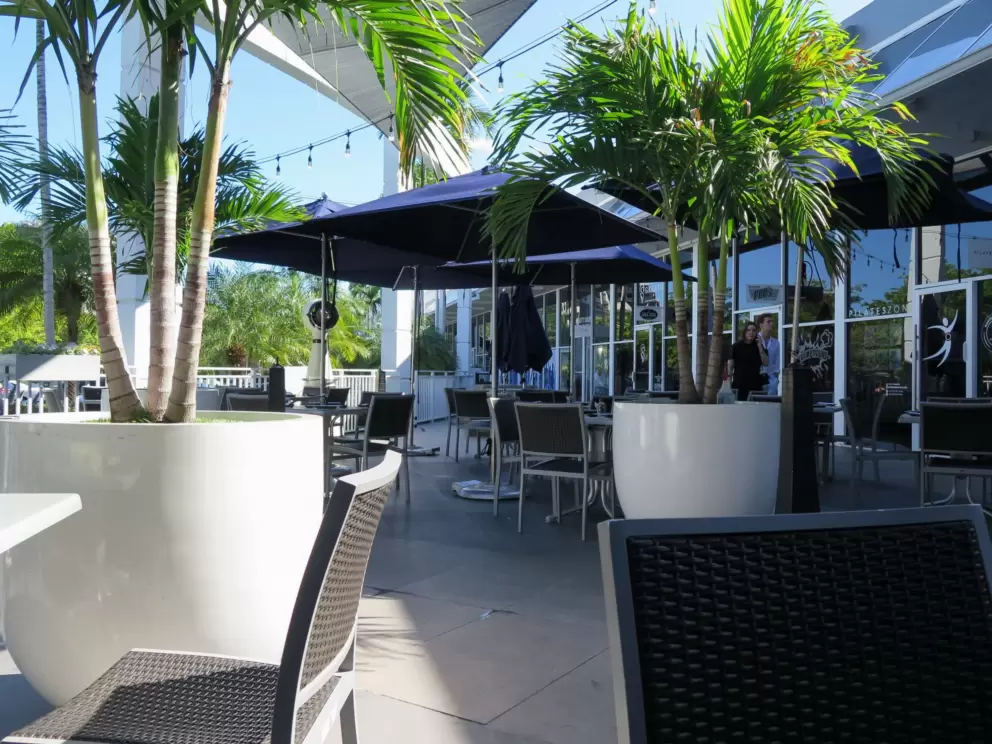 Seating outside Nahuen Gourmet Market, in The Square Shopping Plaza. 