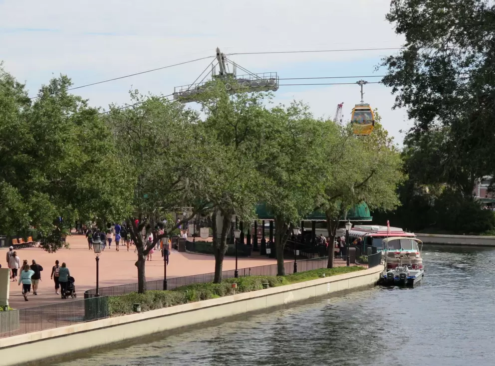 Ferryboat and Skyliner gondolas outside Epcot's International Gateway.