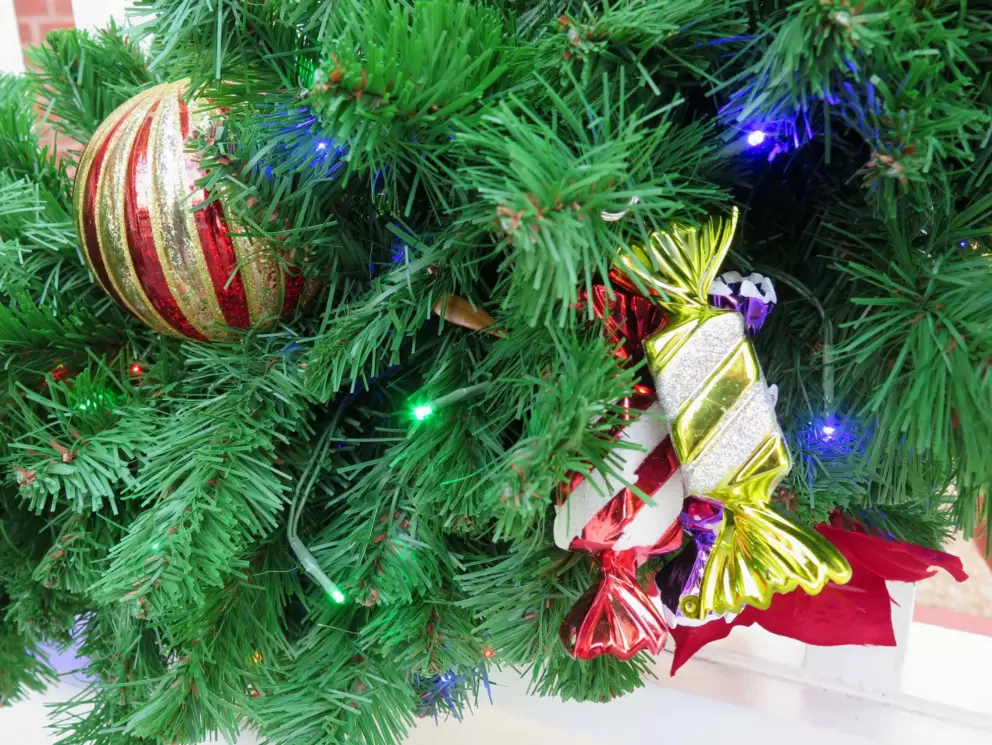 Candies in Christmas garland at staircase of Boardwalk Resort.