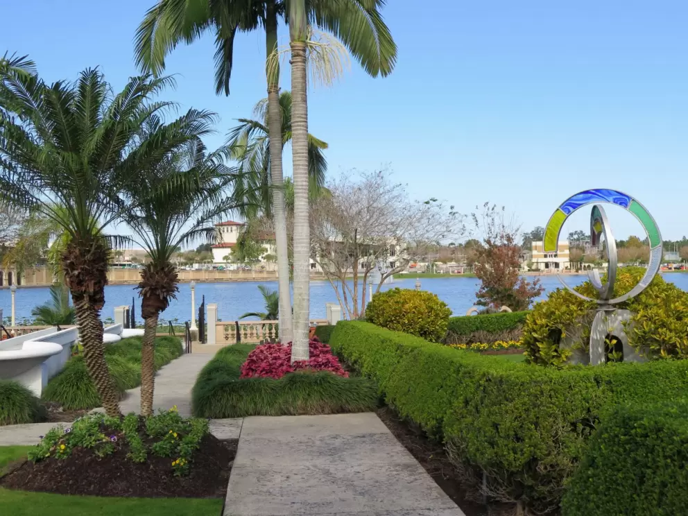 Colorful sculpture and palm trees.