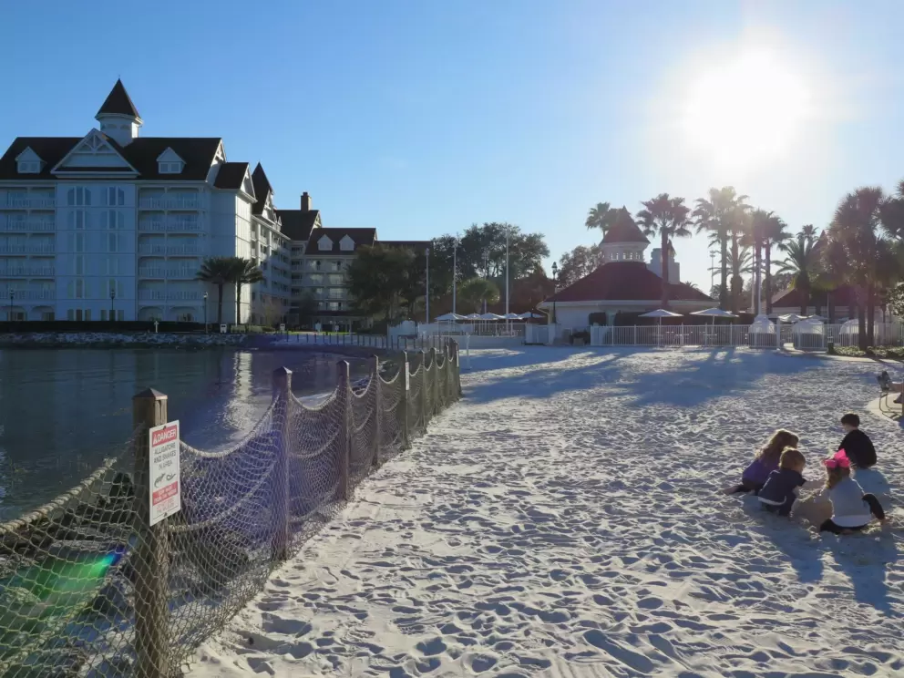 Children play in the fine white sand at the Grand Floridian.