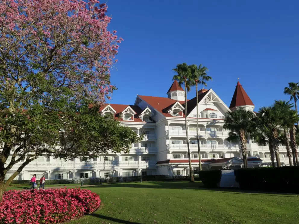 Pink flowers, pink tree, and pretty architecture, at the Grand Floridian.