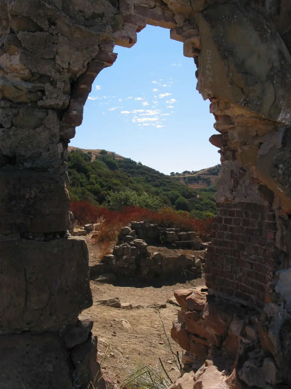 Peering through a sandstone arch.