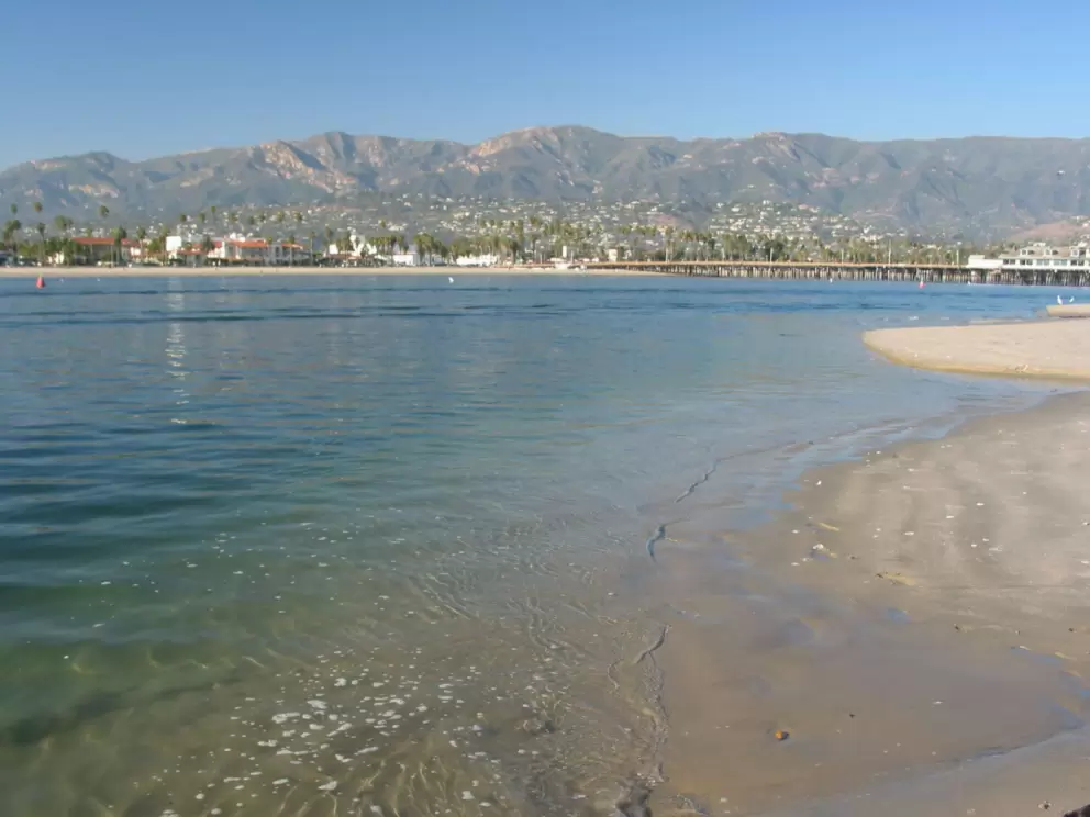 The beach at the end of the little thin cement path that goes over the rocks at the end of the breakwater!