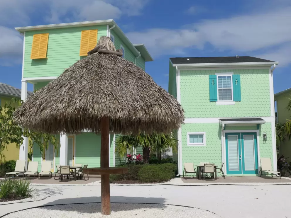 Grass umbrella at the playground and amazing little cottages.