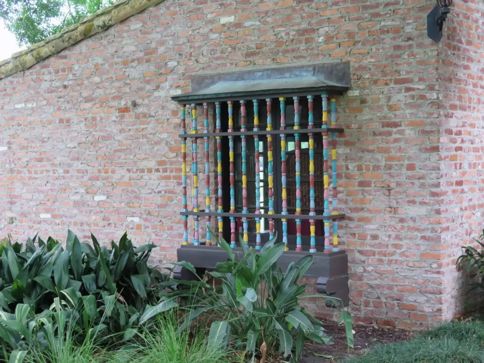 Cute multi-colored window railings.