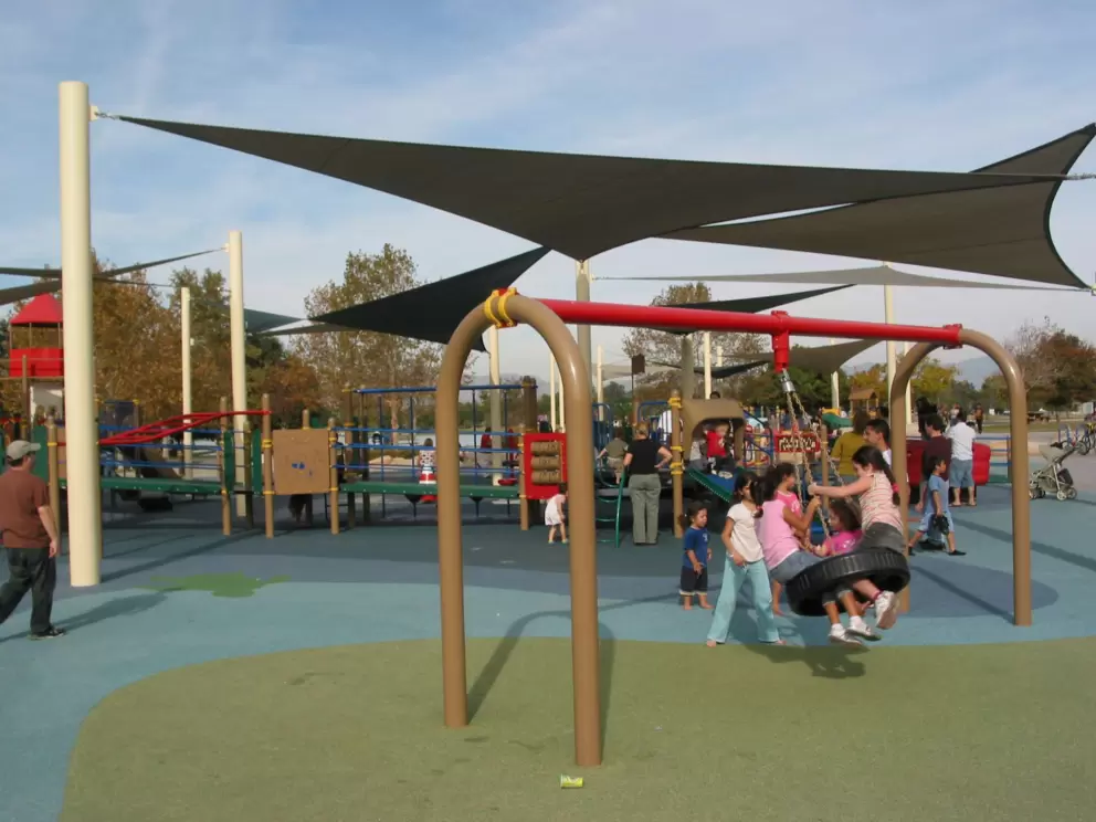 The tire swing, and the groovy canopies behind. 