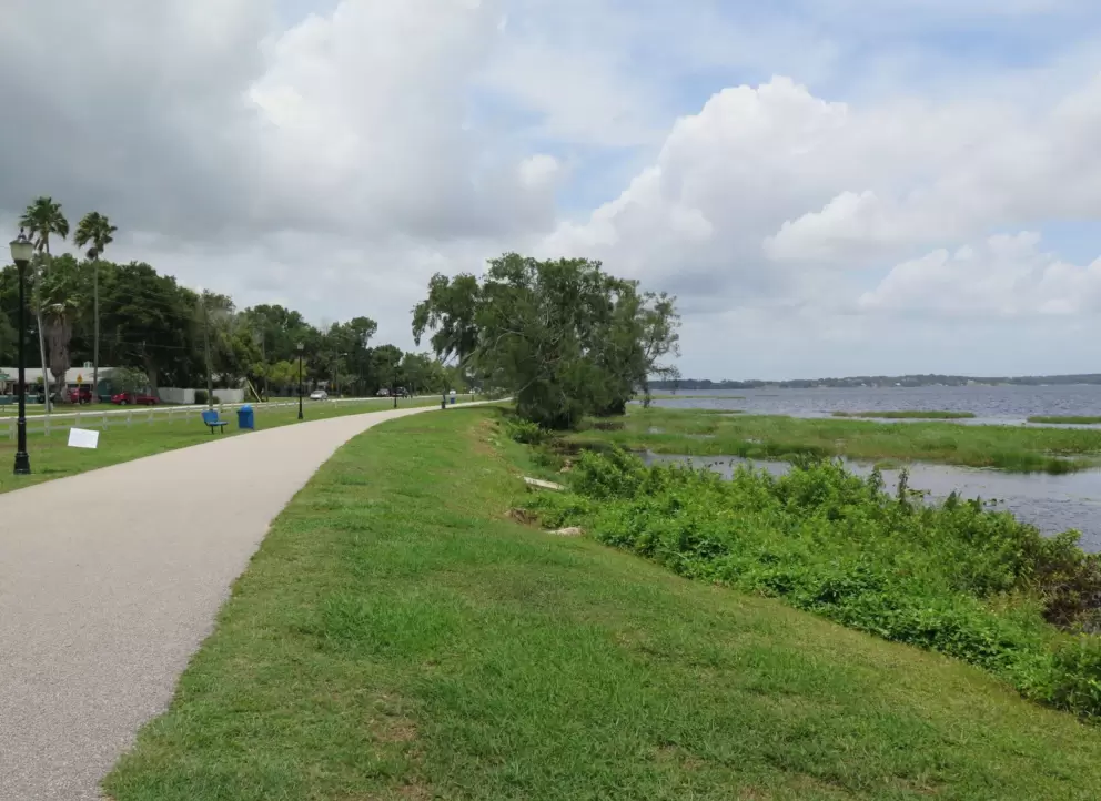 The running path continues along the lake.