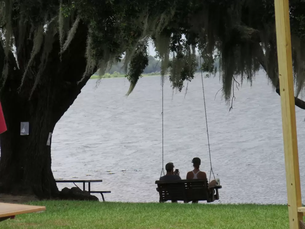 Swinging bench by the pier.