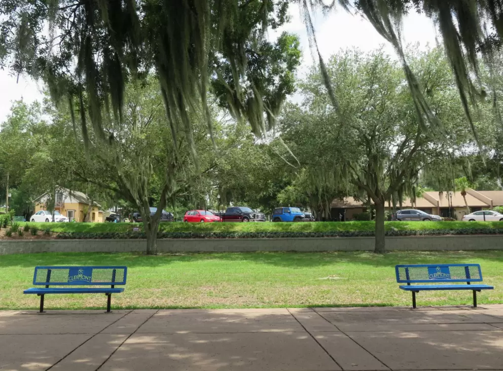Blue benches with a water view.