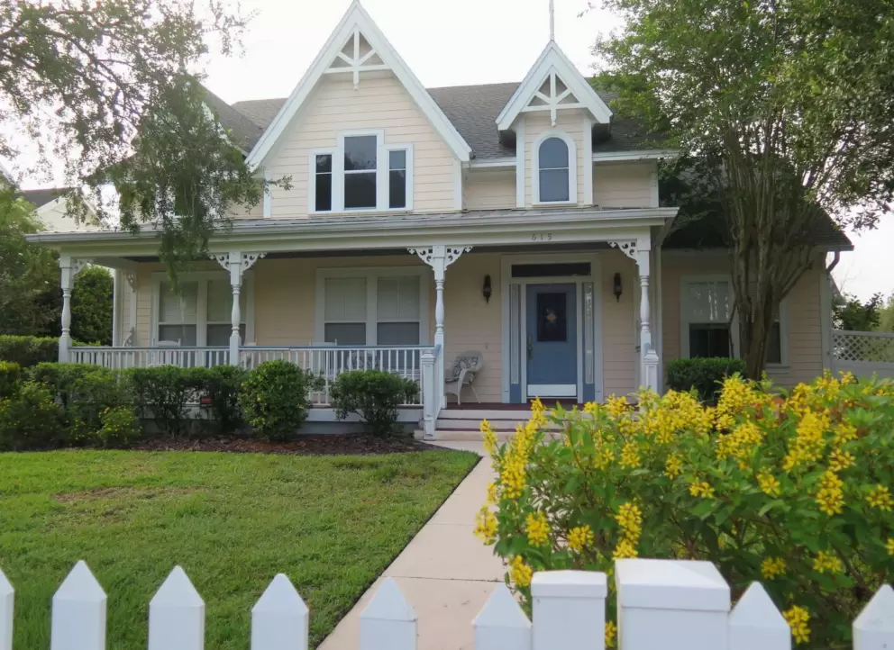 Victorian house and yellow flowers, on Nadine Place. 