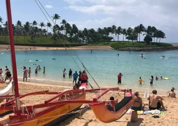 Catamaran and beachgoers at Ko Olina Resort.