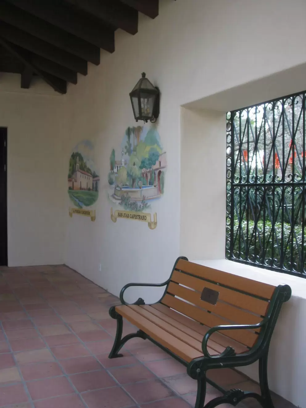 The California mission courtyard walls with murals. 