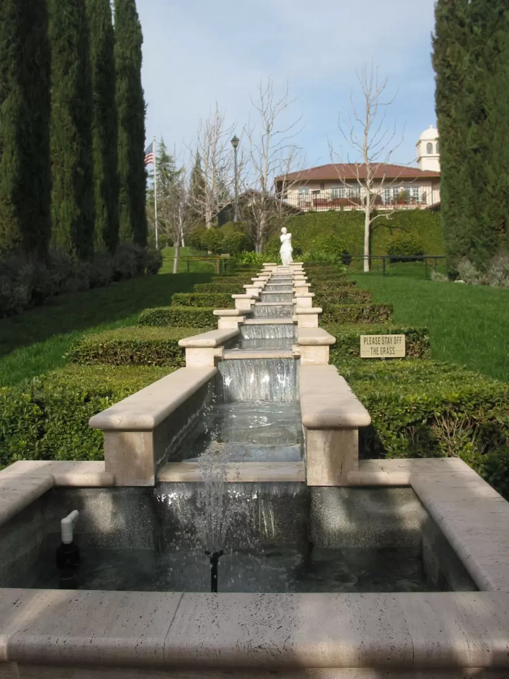 Cypress trees and terraced fountain in the Italian garden.