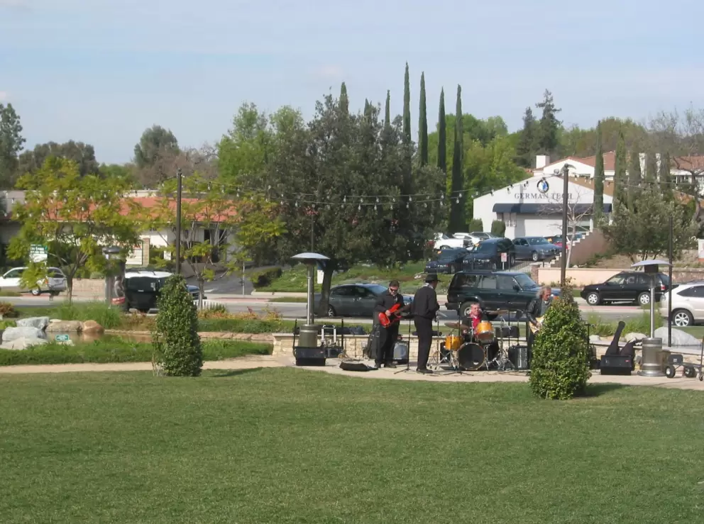 A band plays on the lawn on a weekend afternoon.