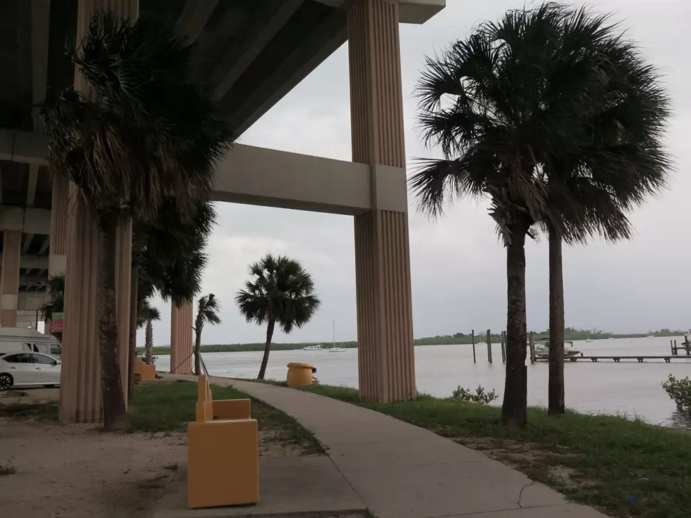 The park is under the bridge.